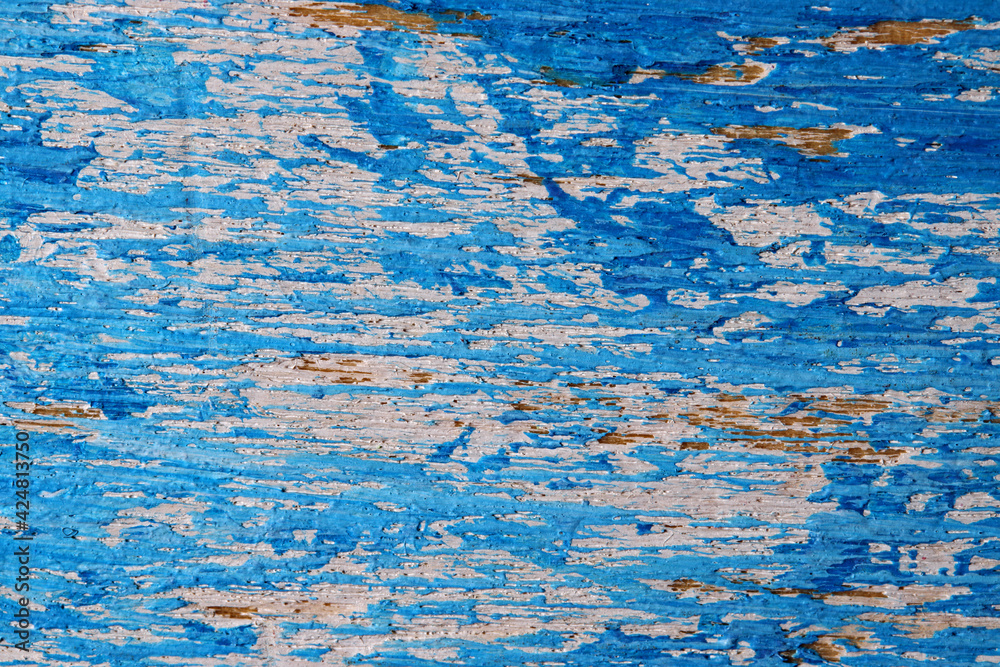 blue paint on a wooden wall
