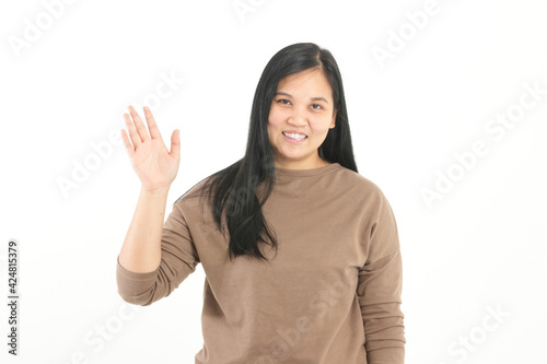Cute fat Asian woman smiling brightly. Standing waving to greet Stay on a white background. The concept of health to lose weight