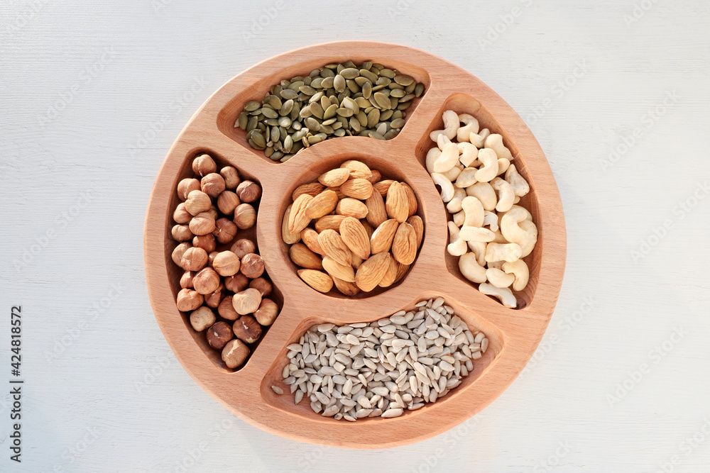 nuts in a wooden tray nuts in a wooden tray