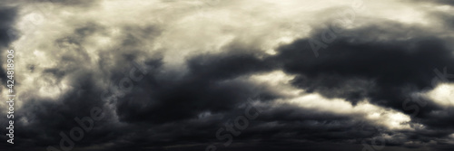 Dramatic dark stormy sky with rain clouds as background