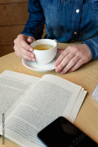 girl drinking green tea in a cafe