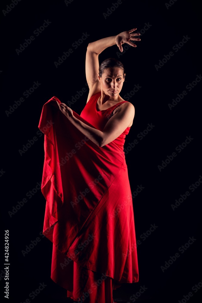 flamenco woman red skirt and picking up skirt Stock Photo | Adobe Stock