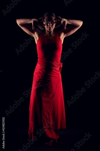 flamenco woman in red skirt and opening fingers