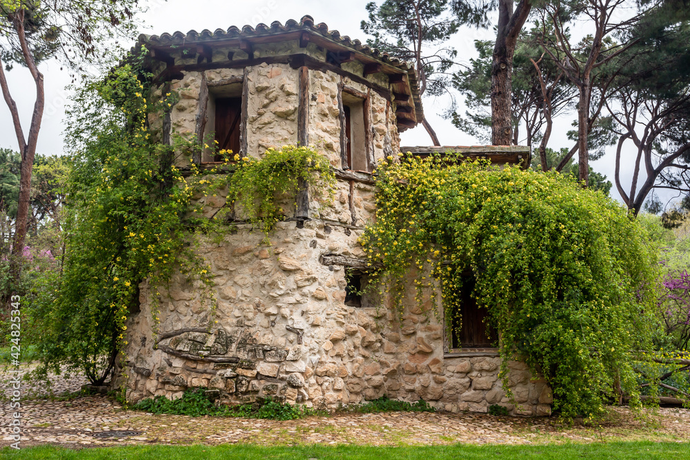 Labrador's house within the Park in Alameda de Osuna. Cottage. Wooden house in the field. Parks and gardens of Madrid