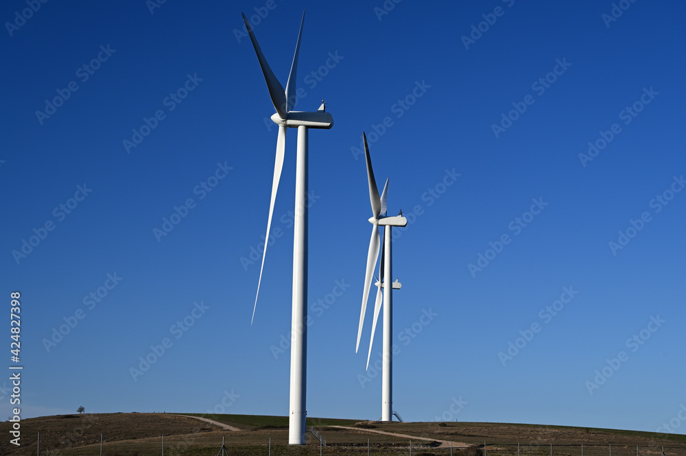 Fototapeta premium Wind turbines on a blue sky in the south of france