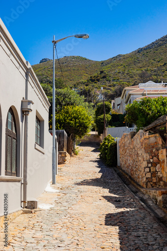 Fototapeta Naklejka Na Ścianę i Meble -  Steep streets for Mountainside  Houses in small coastal town of St James.