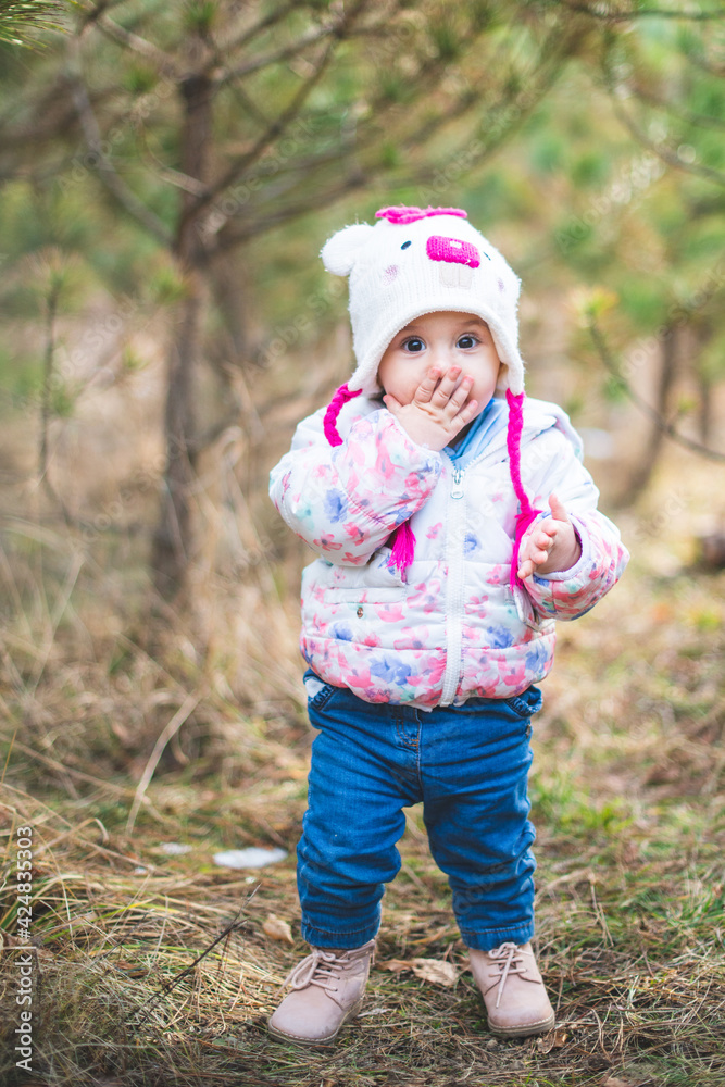 Portrait of little toddler girl having fun outdoors in cold weather at mountains Portrait of little toddler girl having fun outdoors in cold weather at mountains