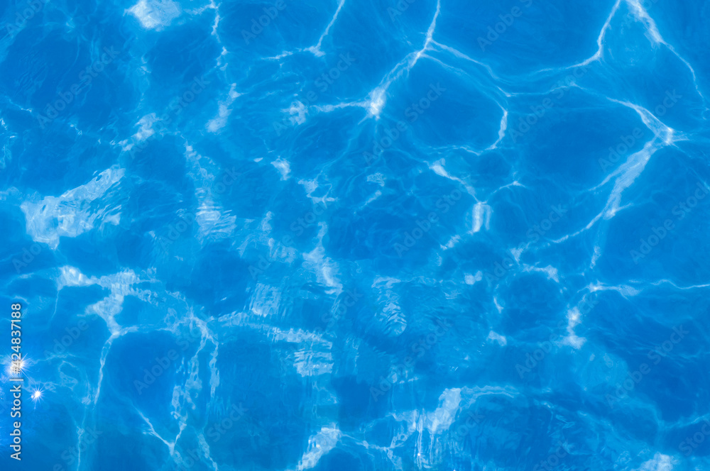 The surface of the clear sea water is blue. Turquoise water ripples, top view. Blue sea background. High quality photo The surface of the clear sea water is blue. Turquoise water ripples, top view. Blue sea background. High quality photo