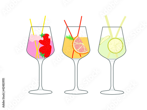 Set of cocktail glasses with pieces of berries and fruit. Refreshing cocktails strawberry, lime, and grapefruit with a sprig of tarragon.. Set of alcoholic cocktails in glass glasses for the party at 