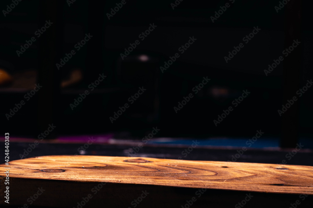 Fried potato spiral tubercle on wooden base and dark background
