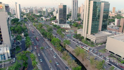 07 AERIAL IMAGE OF AVENIDA AGAMENON MAGALHAES IN THE CENTER OF THE CITY OF RECIFE, PERNAMBUCO, BRAZIL, WITH CARS AND BUSES PASSING ON THE ASPHALT DOLLY IN MOTION photo