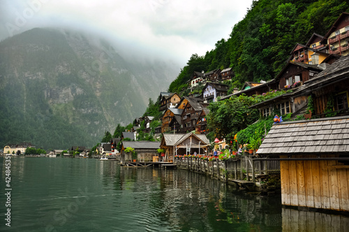 Hallstatt is the old town located on the bank of Hallstatter see (lake) at the foot of Salzberg Mount and surrounded by Dachstein Alps, Salzkammergut, Austria. photo