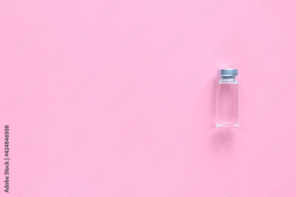 Ampoule of vaccine on pink background. Ampoule of vaccine on pink background.