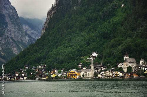 Hallstatt is the old town located on the bank of Hallstatter see (lake) at the foot of Salzberg Mount and surrounded by Dachstein Alps, Salzkammergut, Austria. photo