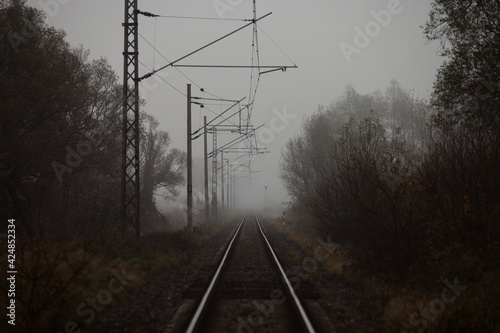 railway track in a gloomy autumn morning. Depression and negative emotions. Escape plan