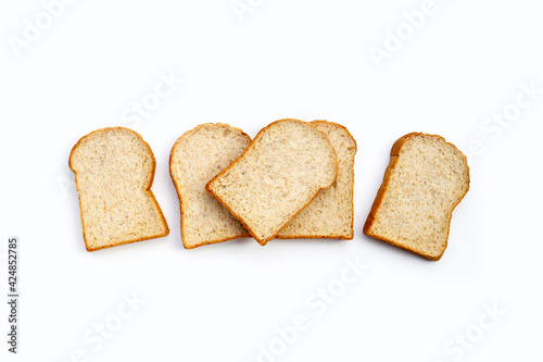 Sliced whole wheat bread on white background.