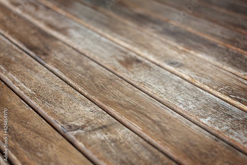 Wooden brown background. Aged wooden countertop in perspective. Selective focus. Copy space.