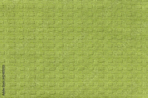 abstract background of linen green fabric close up