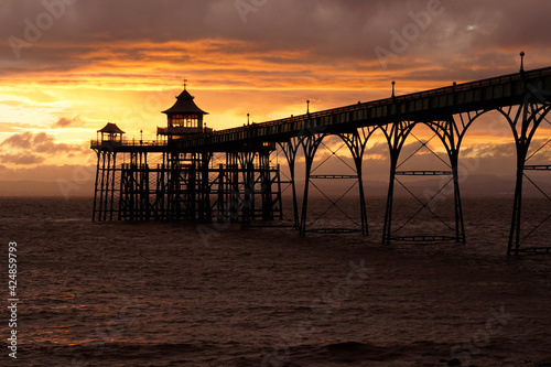 sunset on the beach  pier  clevedon  old pier  England 