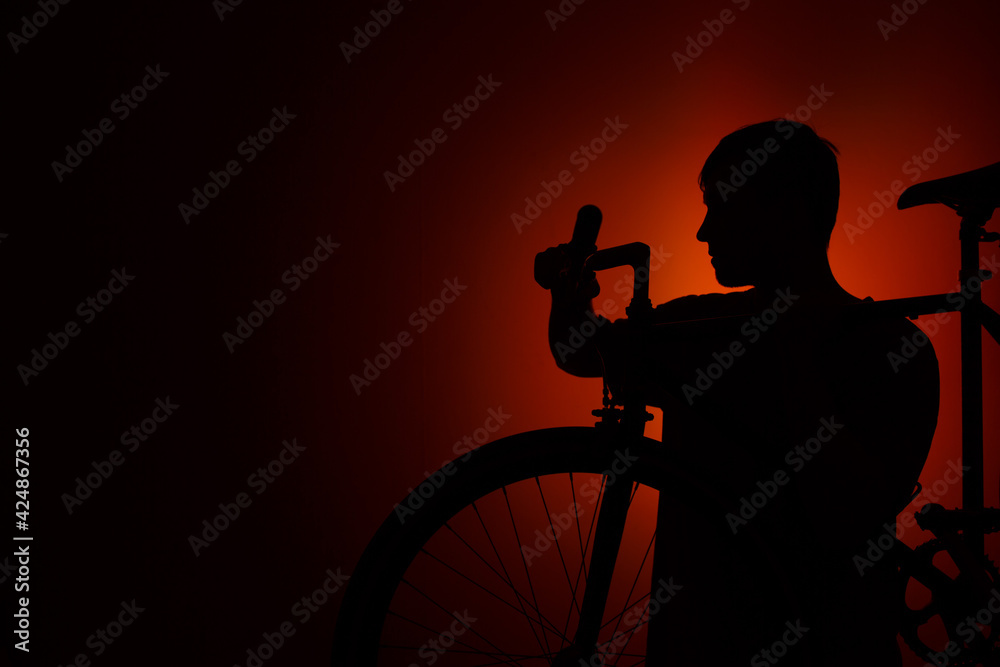 Silhouette of a man in red light.