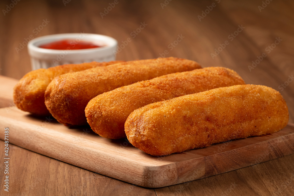 Fried risoles or Risol. Risoles stuffed with cheese and ham. Fried risoles or Risol. Risoles stuffed with cheese and ham.