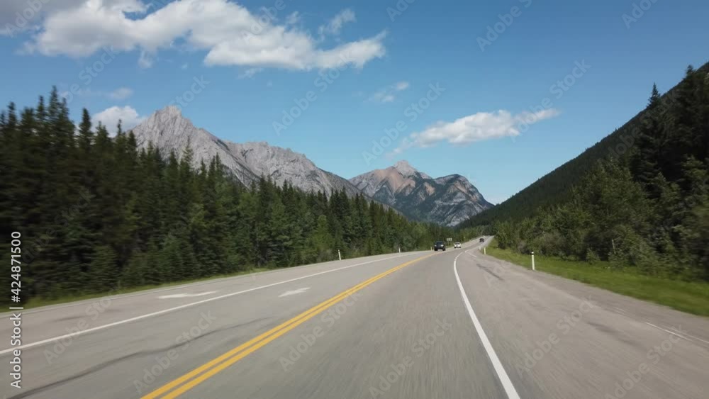 Smooth Drive in Nature Through Kananaskis During Sunny Day Towards Banff Smooth Drive in Nature Through Kananaskis During Sunny Day Towards Banff