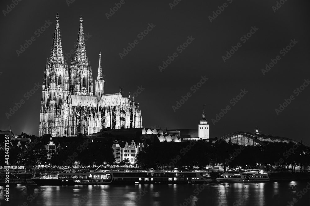 Cologne, Germany. View Of Cologne Cathedral. Catholic Gothic Cathedral In Night. UNESCO World Heritage Site. Black And White Colors