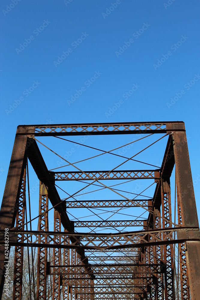 Top of steel bridge with early spring sky
