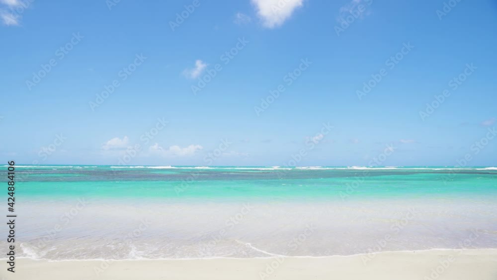 Vivid beach background 4k stock video. Empty beach landscape, nobody, copy space. Beach and sea turquoise landscape. Summer vacation on the beach. Vivid beach background 4k stock video. Empty beach landscape, nobody, copy space. Beach and sea turquoise landscape. Summer vacation on the beach.