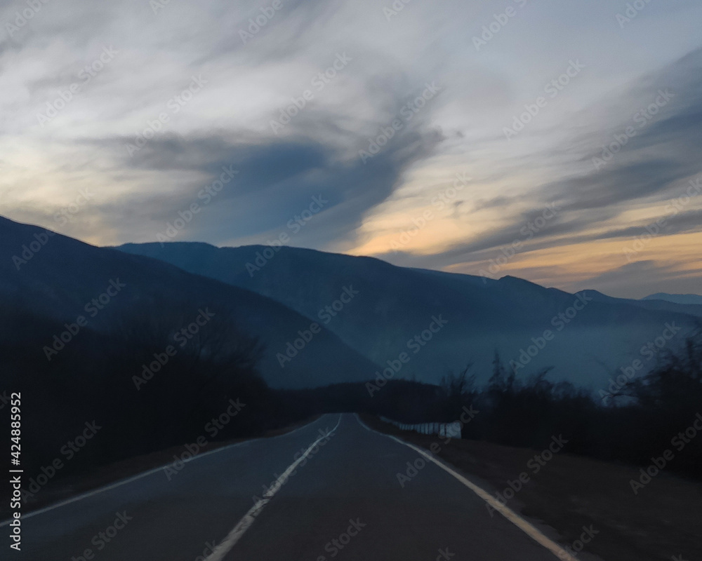 Naklejka premium road to the mountains