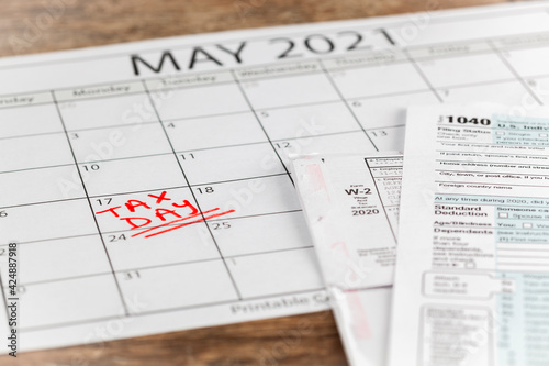 Internal Revenue Service (IRS) has extended the deadline for filing US federal income tax until May 17 2021. Concept image showing a calendar page marking the new tax day for 2021.