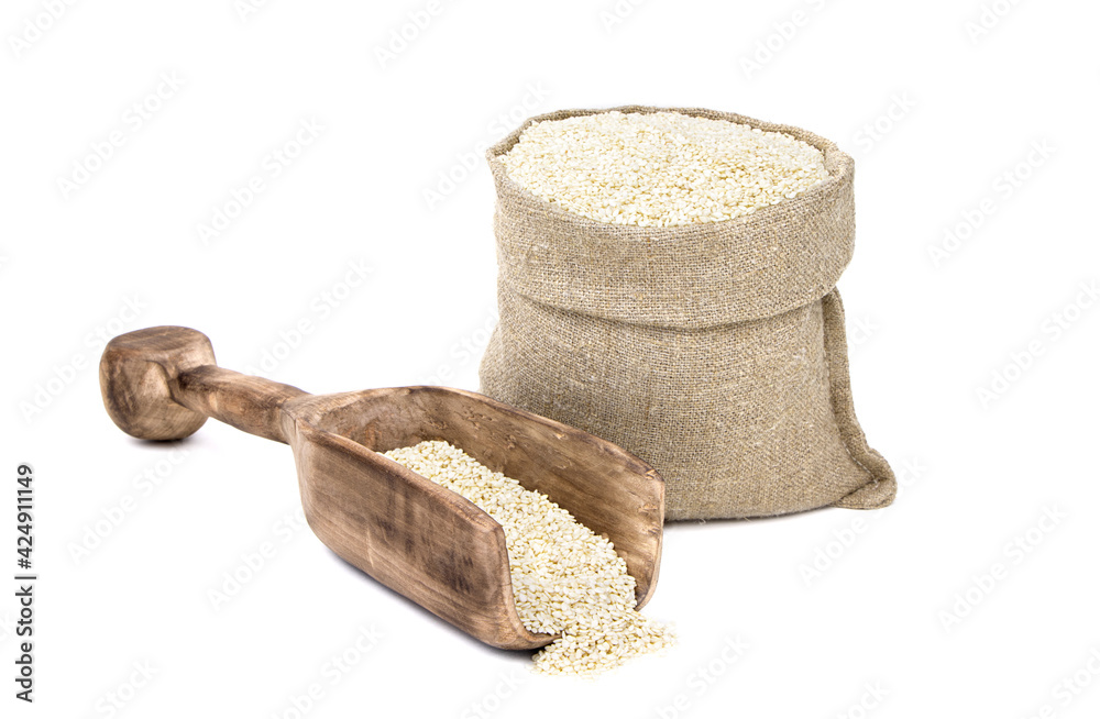Seeds of sesame in a sack of isolated on a white background. Til in a burlap sack. Healthy food. Benne in a jute bag. Vegan food Seeds of sesame in a sack of isolated on a white background. Til in a burlap sack. Healthy food. Benne in a jute bag. Vegan food