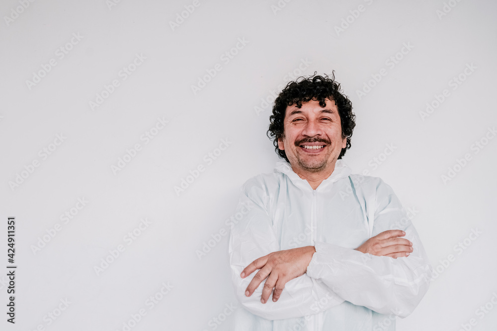 handsome doctor smiling whit mustache whit a space in the left , covid, surgeon handsome doctor smiling whit mustache whit a space in the left , covid, surgeon