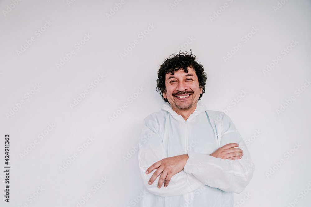 handsome doctor smiling whit mustache whit a space in the left , covid, surgeon handsome doctor smiling whit mustache whit a space in the left , covid, surgeon