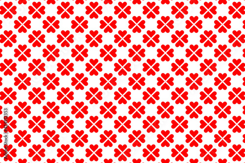 Patrón de corazones rojos agrupados de 4 en 4 formando tréboles sobre fondo blanco