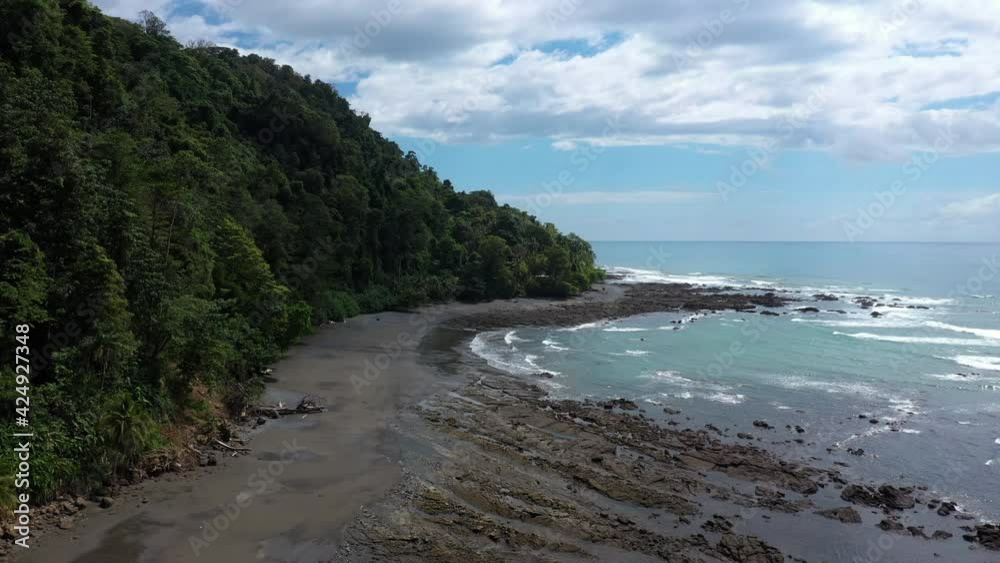 drone flight along a jungle by the ocean Costa Rica punta banco sunny day tropical destination wilderness