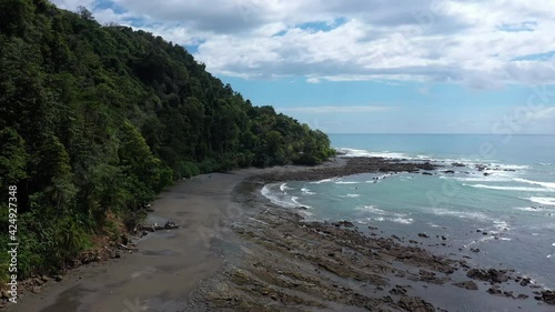 drone flight along a jungle by the ocean Costa Rica punta banco sunny day tropical destination wilderness photo