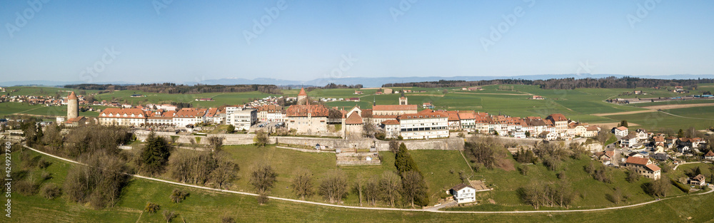 Aerial panorama image of old Swiss town Romont, built on a rock prominence, in Canton Freibourg, Switzerland