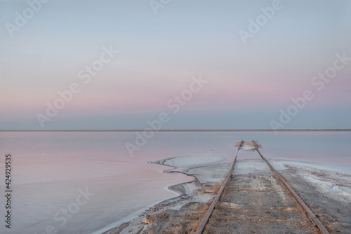 sunrise pink lake salt rails horizon