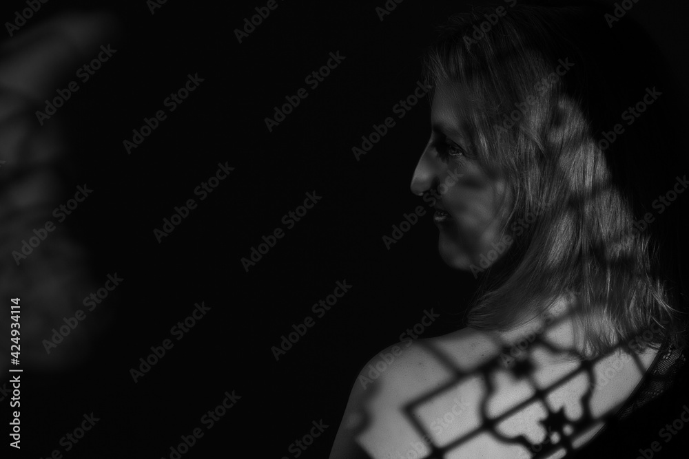 black and white portrait of an overweight woman. Art photography with unusual shadows black and white portrait of an overweight woman. Art photography with unusual shadows