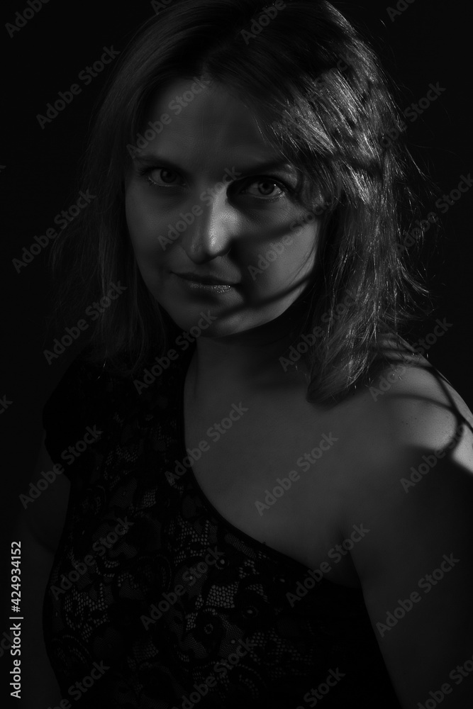 black and white portrait of an overweight woman. Art photography with unusual shadows black and white portrait of an overweight woman. Art photography with unusual shadows