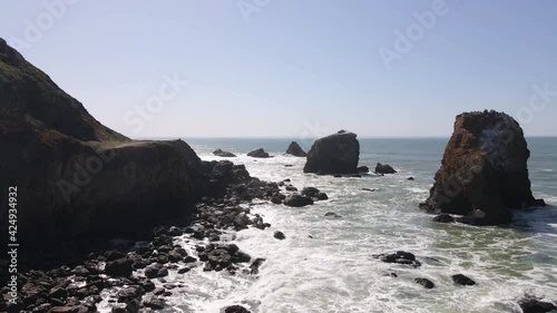 4K Aerial drone video of rocky seaside shore and cliffs