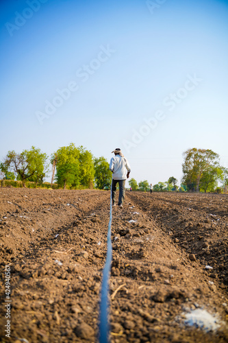 Drip irrigation system assemble in agriculture field. rural scene.