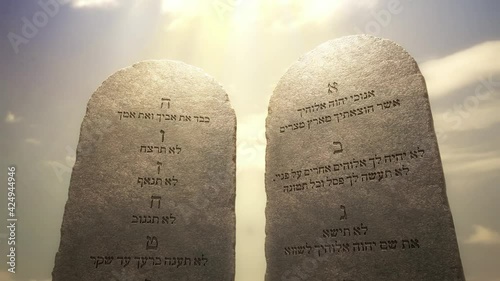 Golden letters of the Ten Commandments on the stone tablets. God told Moses about the Ten Commandments on the stone tablets. Excerpted from the Bible, Exodus 20:1-17, 3D rendered animation.