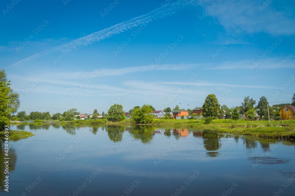Fototapeta premium Rural river and blue sky