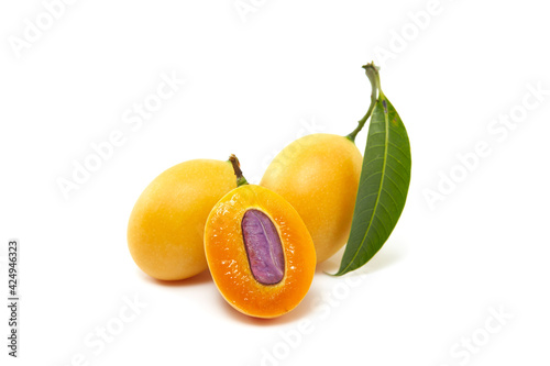 Sweet Yellow Marian plum with leaves photo