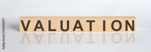 VALUATION word written on cube shape wooden blocks on the white background