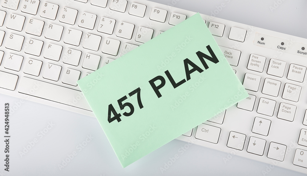 text 457 PLAN on envelope on keyboard on the white background text 457 PLAN on envelope on keyboard on the white background