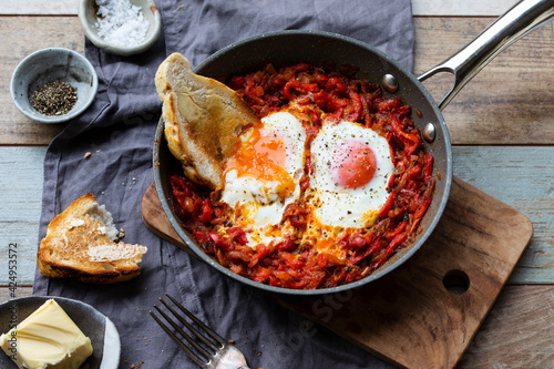 Obraz na plátně Nduja eggs with fried red peppers and onion