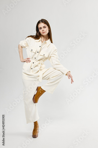 pretty woman brown boots bent leg studio isolated background